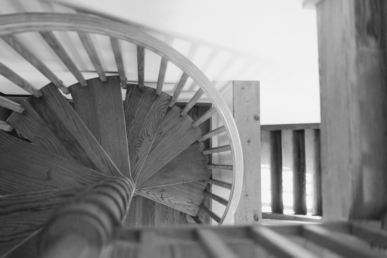 Wooden spiral staircase detail inside the Terrace Suite at Chateau Lill.