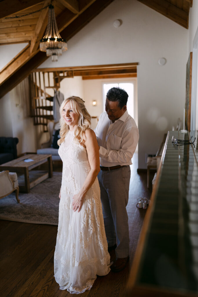 Bride and groom getting ready together in the Terrace Suite at Chateau Lill.