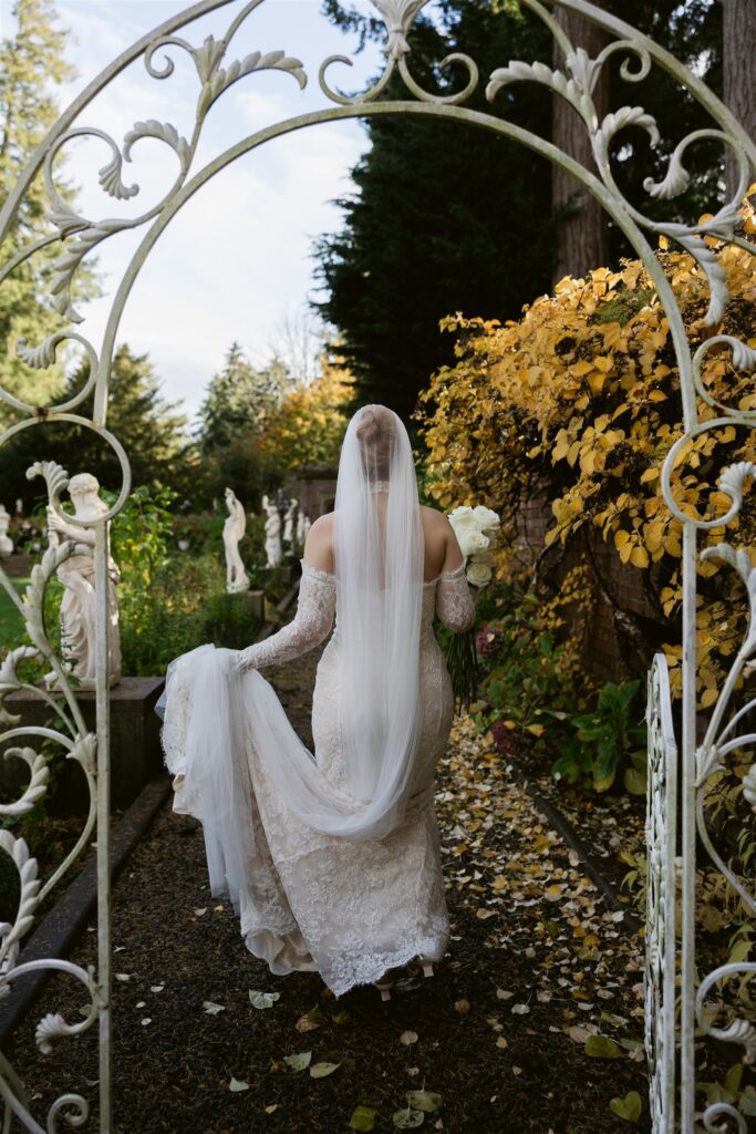 Bride walking into the Sunken Garden at Thornewood Castle.