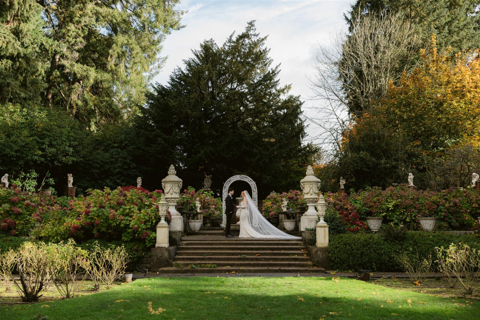 Bride and groom during their first look in the Sunken Gardens at Thornewood Castle in Lakewood, Washington.
