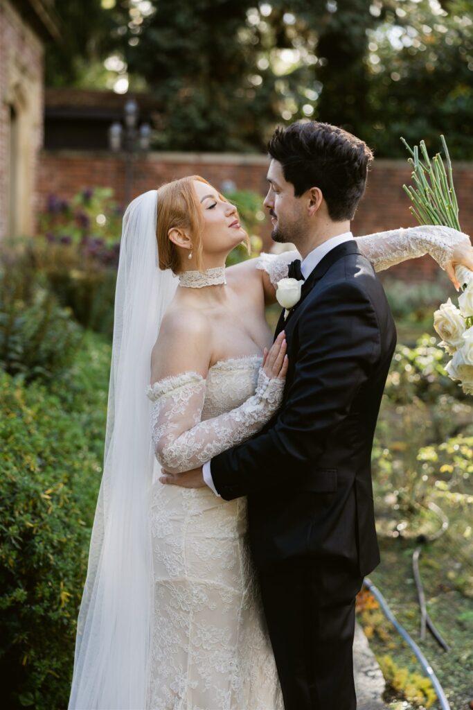 Bride and groom during their first look in the Sunken Gardens at Thornewood Castle in Lakewood, Washington.