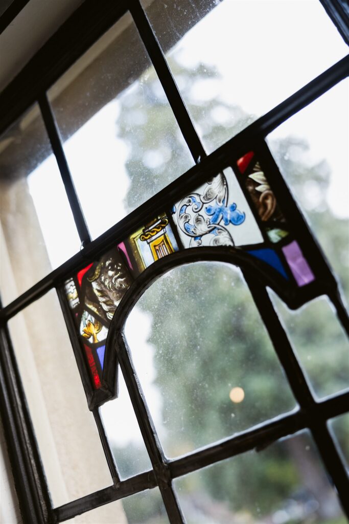 Medieval stained glass at Thornewood Castle wedding venue in Washington.