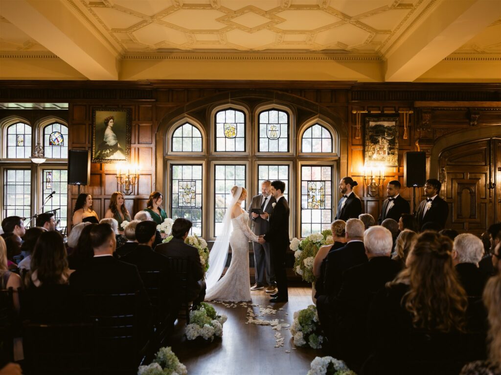 An indoor wedding ceremony at Thornewood Castle, a historic Tacoma wedding venue.