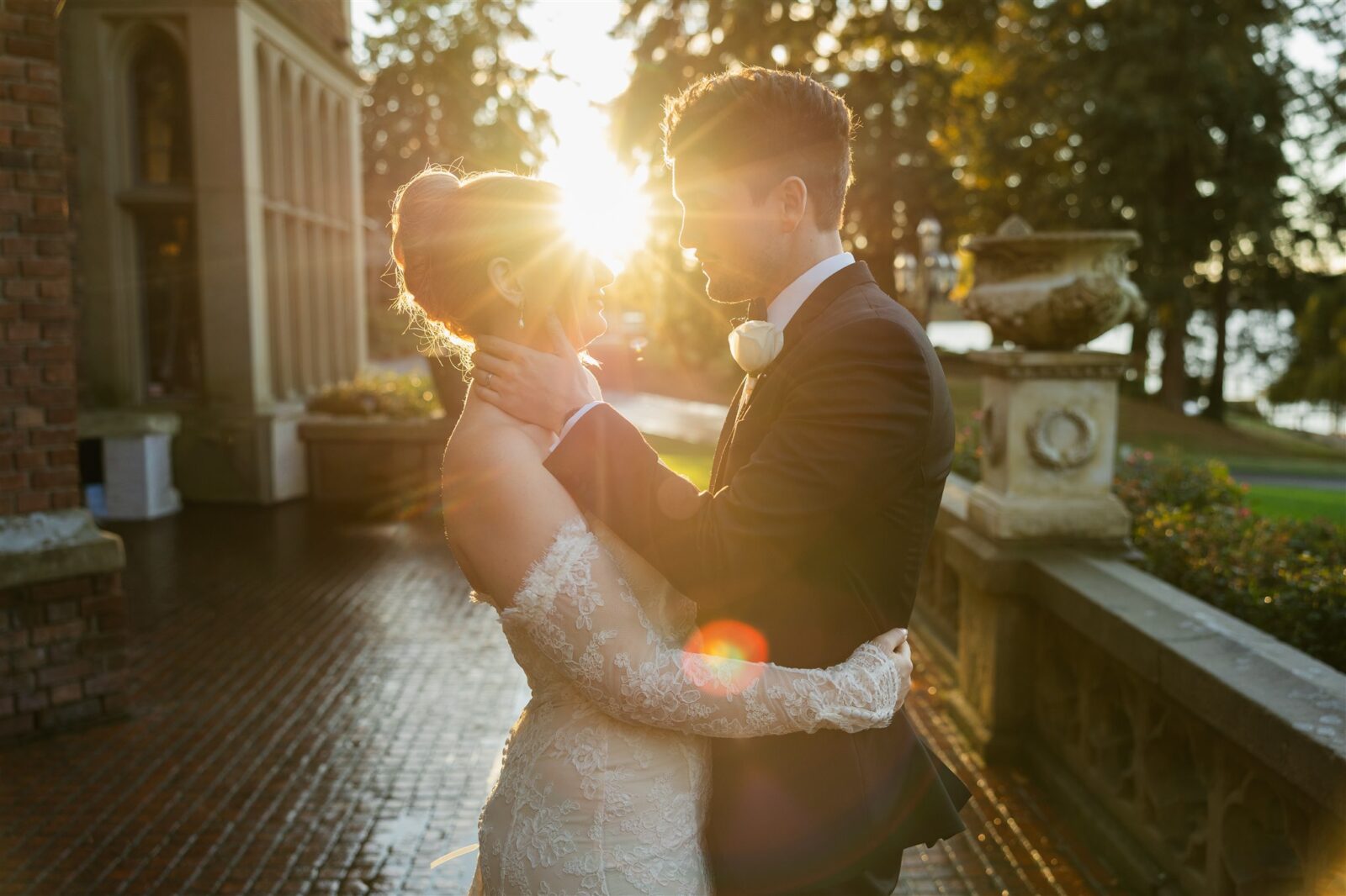 Golden hour photo of thge bride and groom standing together outside of Thornewood Castle.