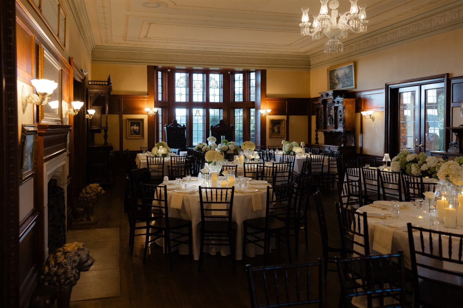 An indoor wedding reception in the ballroom at Thornewood Castle in Lakewood, WA.