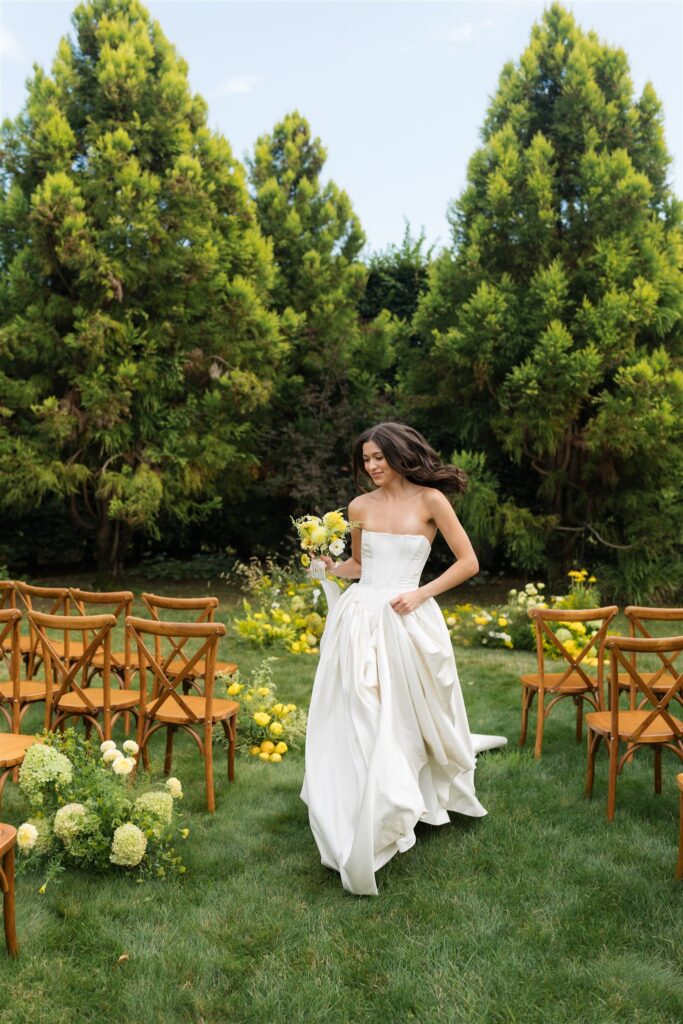 Bride running down the ceremony aisle at Briarwood Estate wedding venue in Washington.