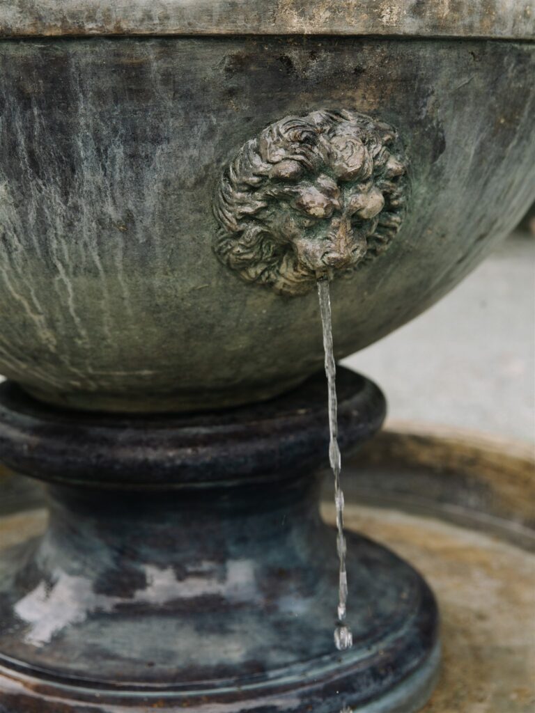 Close-up of stone fountain detail in the garden at Briarwood Estate wedding venue in Washington.
