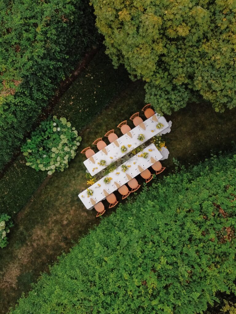 Aerial view of Briarwood Estate wedding reception layout with long tables surrounded by greenery.