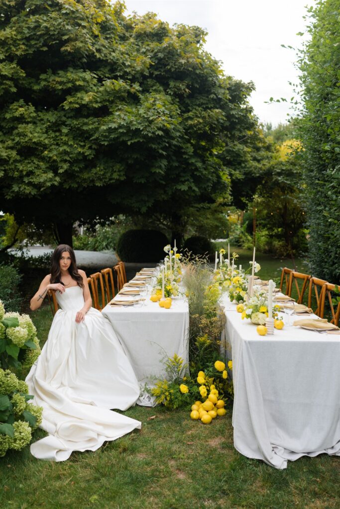 Bride sitting at a styled wedding reception table at Briarwood Estate wedding venue in Mount Vernon
, WA.