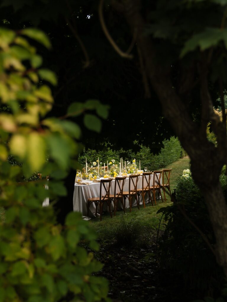 Reception table with candles, florals, and neutral linens at Briarwood Estate wedding venue.