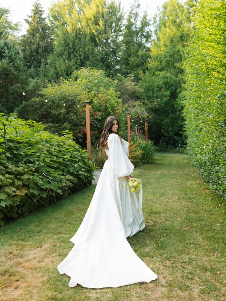 Bride walking through the gardens at Briar Estate in Washington.