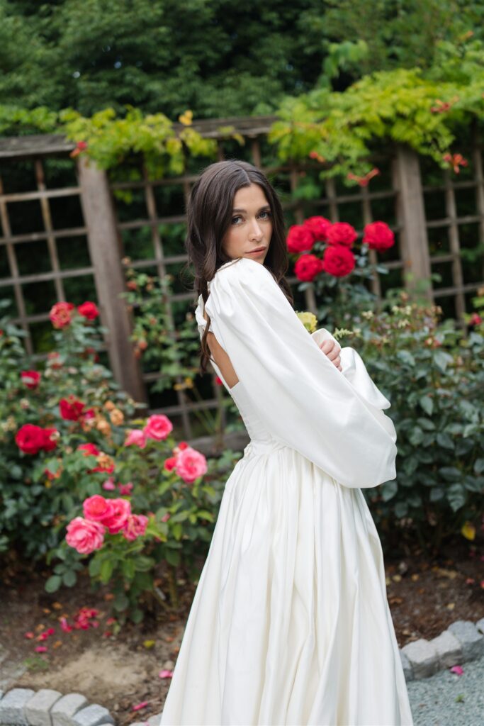 Bride portrait surrounded by roses at Briarwood Estate wedding venue.