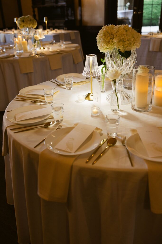 Romantic indoor wedding reception in the ballroom.