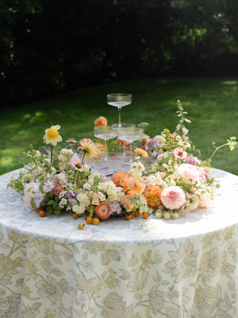 Colorful champagne tower with florals.