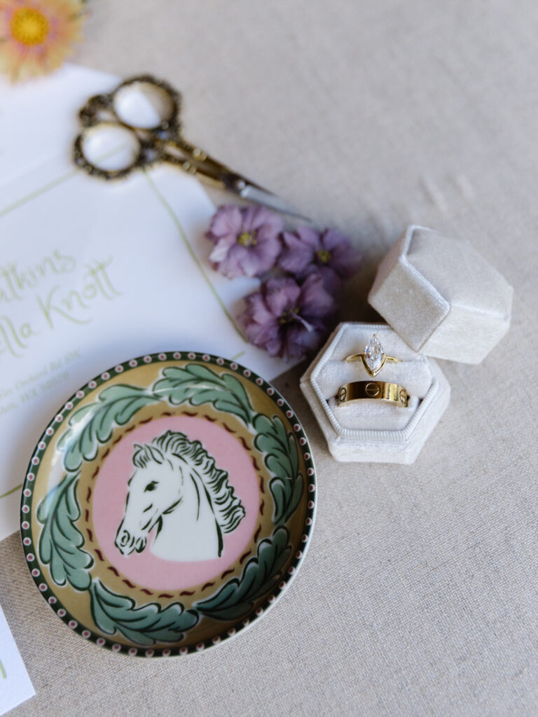 Wedding rings styled with horse dish, vintage scissors, and flowers at Foxglove Lodge Vashon Island.