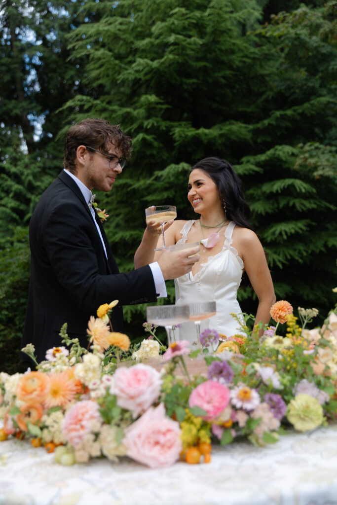 Couple toasting drinks during their champagne tower pouring.