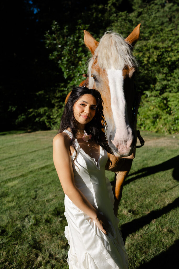 Bride posing with a horse at Foxglove Lodge wedding venue on Vashon Island, WA.