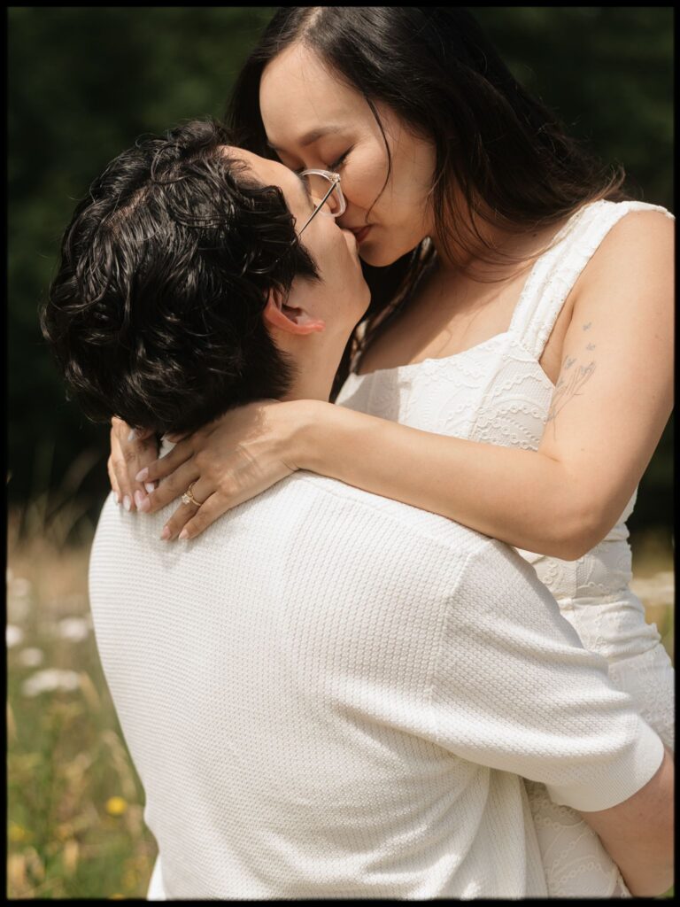 Couple kissing for their Bloedel Reserve engagement photos.