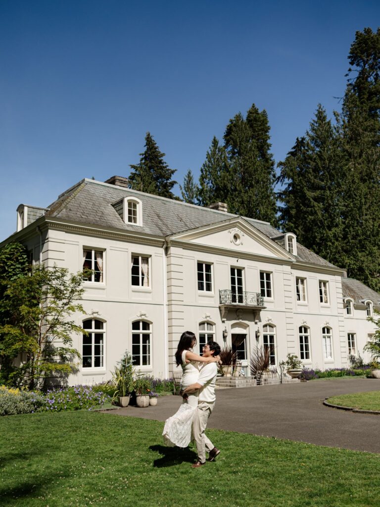 Couple posing in front of The Residence at Bloedel Reserve in WA.