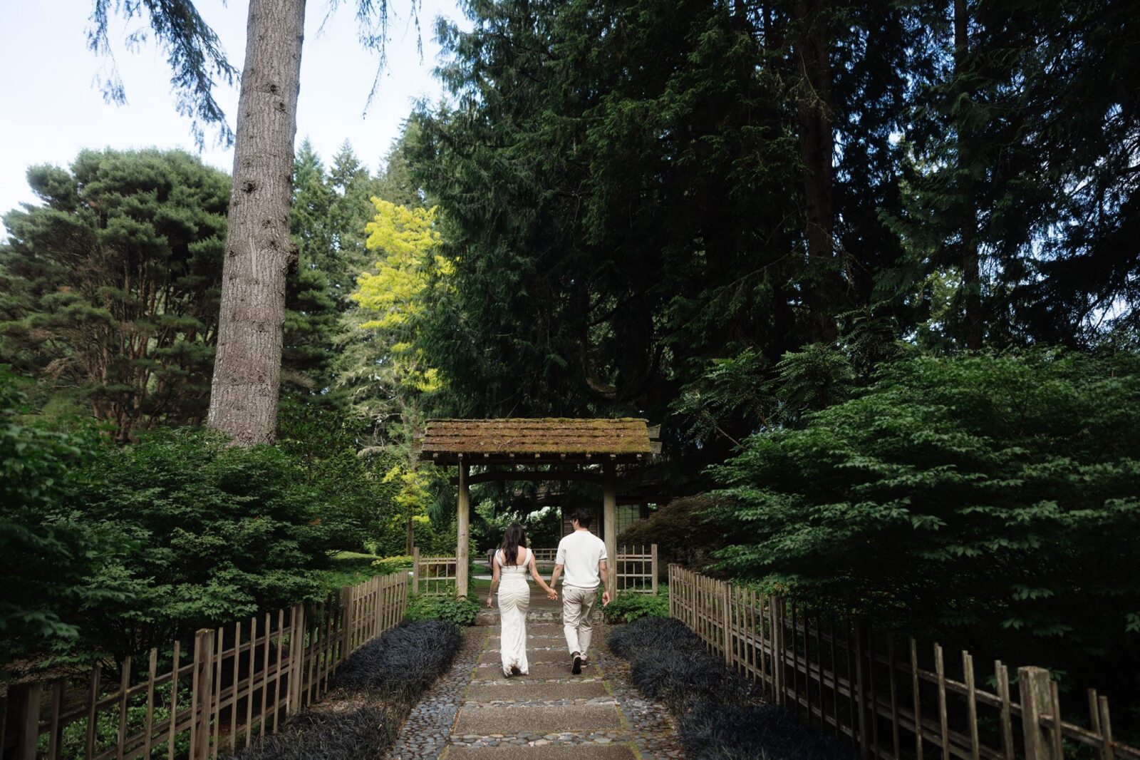 Couple walking a pathway together.