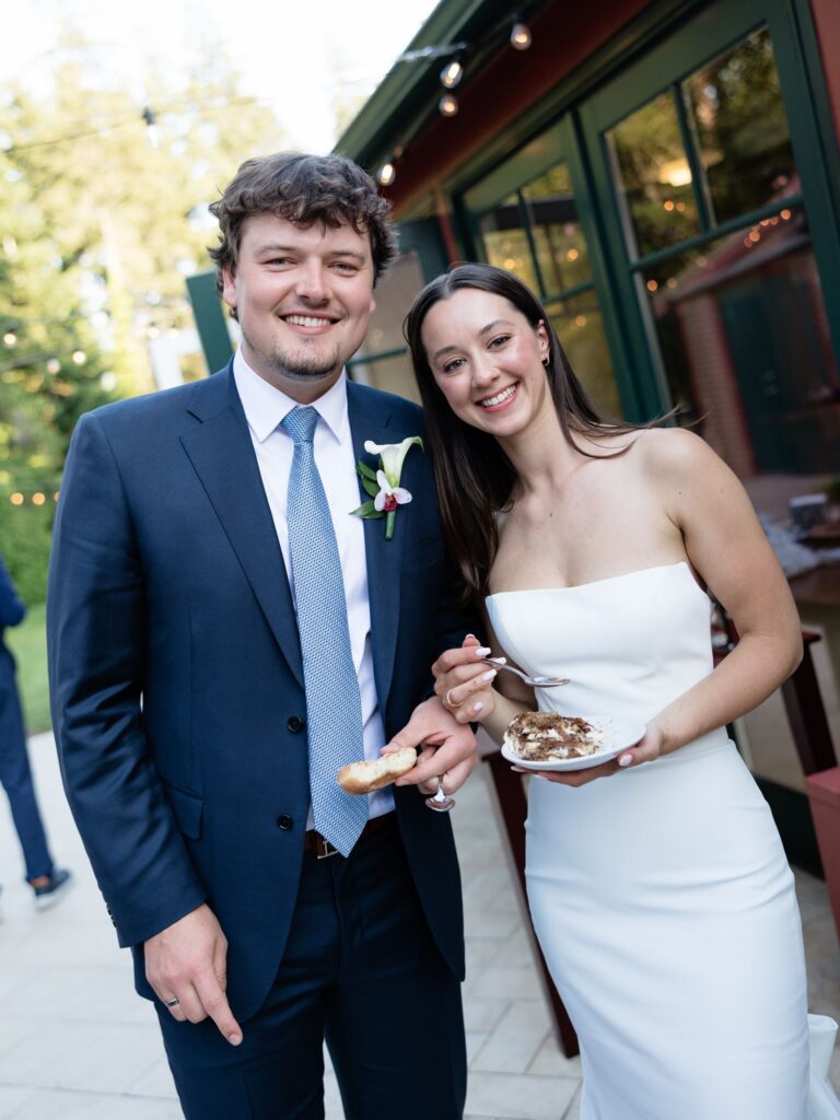 Bride and groom smiling after their cake cutting.