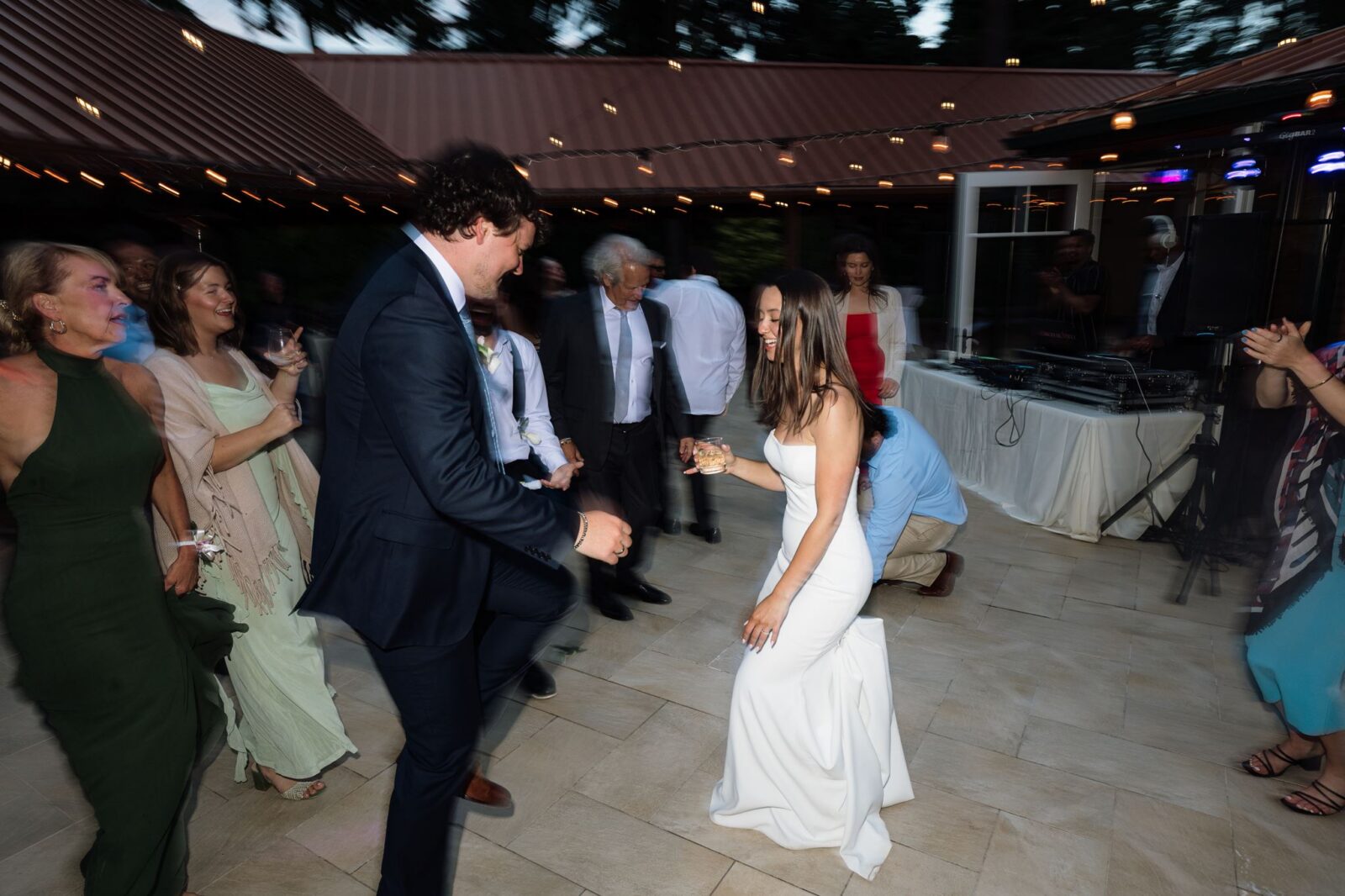 Bride and groom dancing together during their Froggsong Gardens wedding reception.
