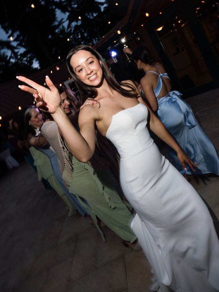 Bride dancing during her Froggsong Gardens wedding reception.