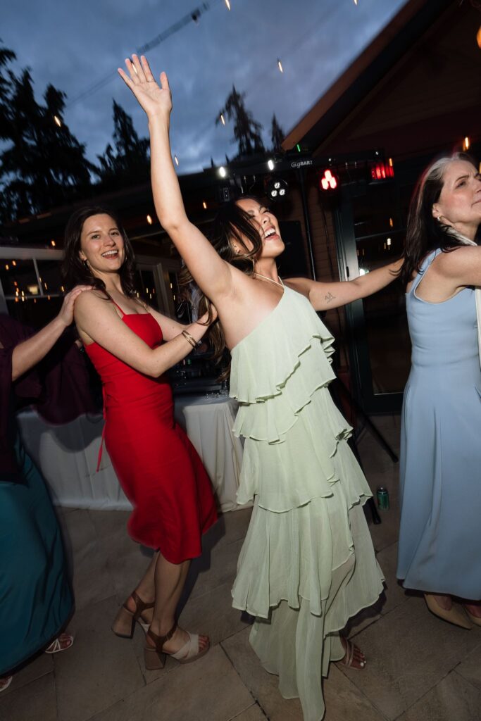 Guests dancing during a Froggsong Gardens wedding reception.