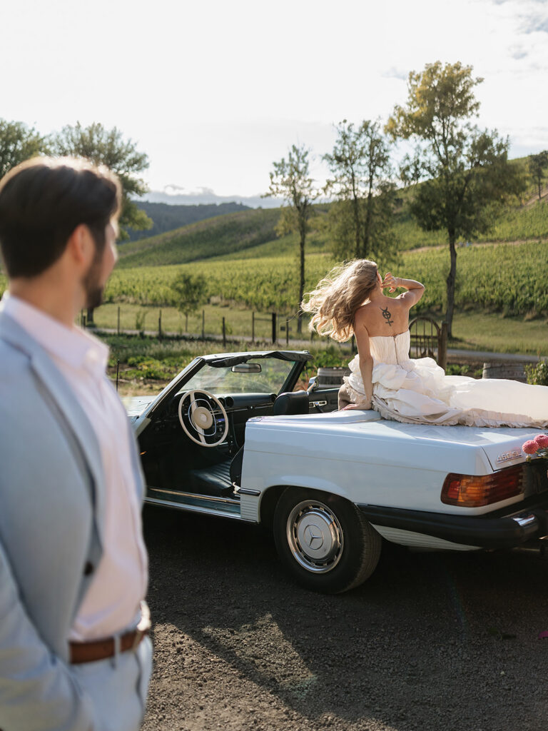 Bride and groom posing in the vineyards at Maysara Winery. 