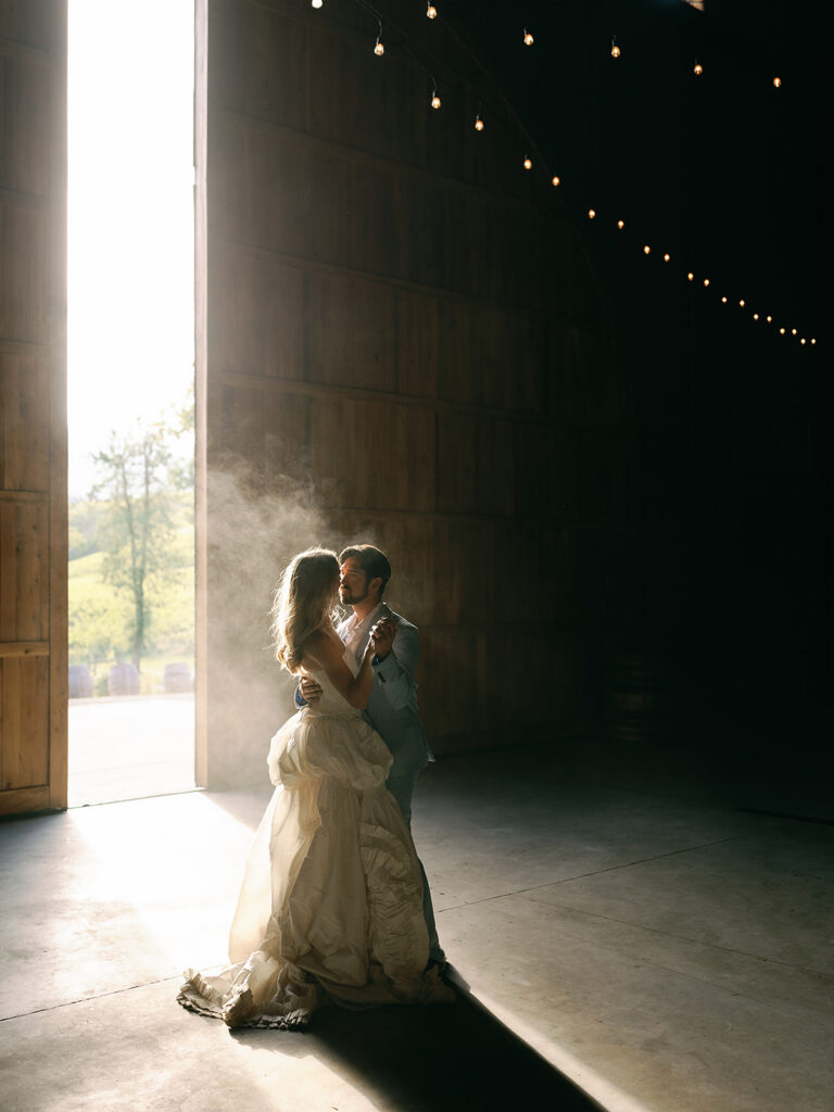 Bride and groom dancing in their wedding reception space at Maysara Winery.
