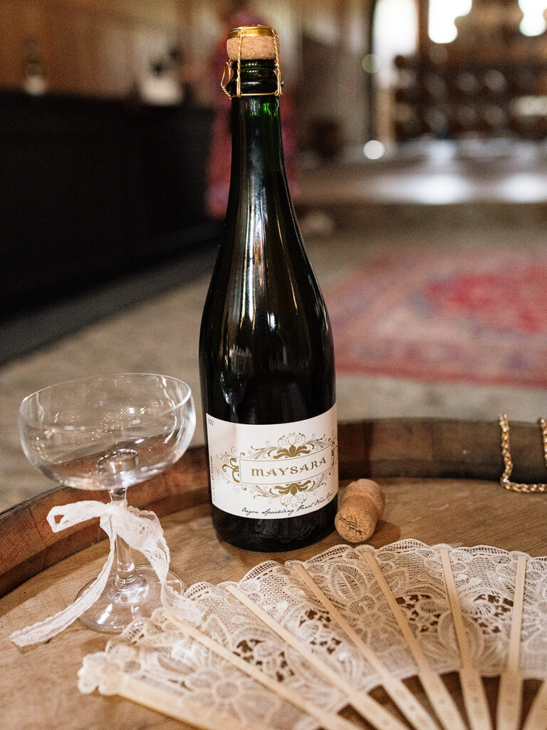 Wine bottle styled on a table at Maysara Winery.
