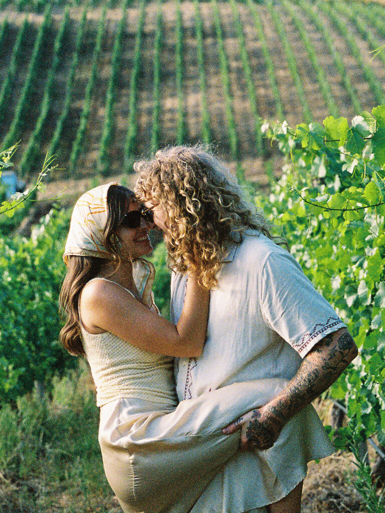Couple being playful together at Maysara Winery in Oregon.
