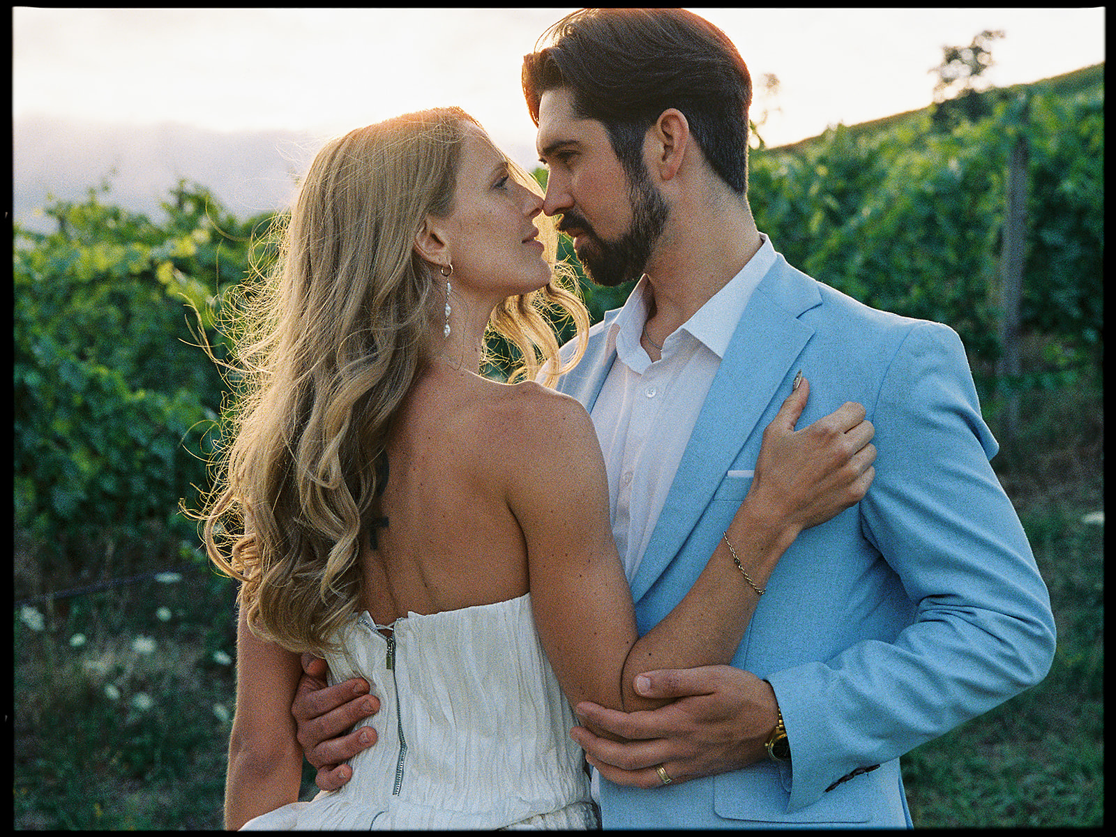 Film photo of a bride and groom posing in the vineyard at Maysara Winery.