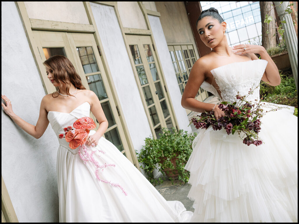 Two brides posing together at The Ruins in Seattle for a wedding editorial.