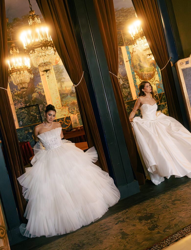 Two brides posing in doorways at The Ruins in Seattle for a wedding editorial.