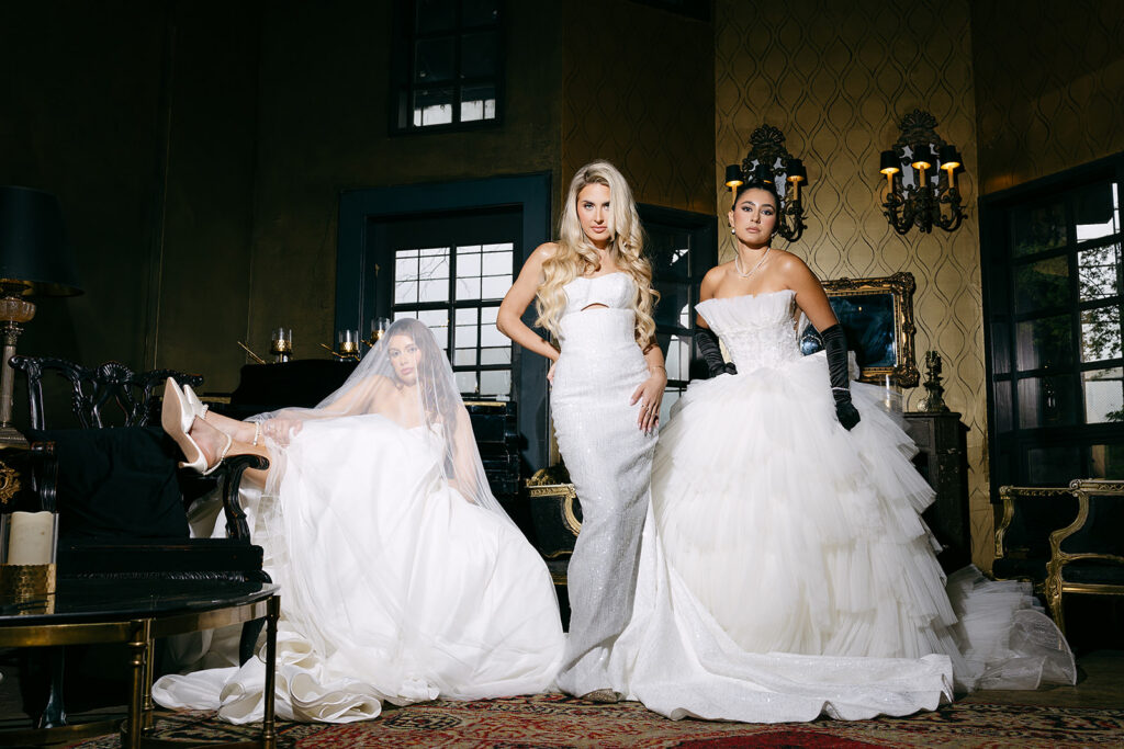 Wide flash photo of brides posing inside The Ruins in Seattle for a wedding editorial.